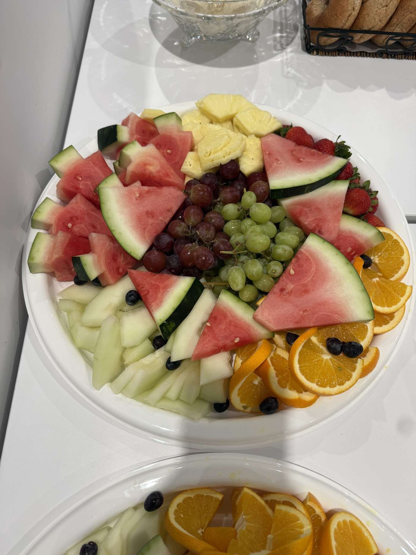 Circular fruit tray with watermelon, honeydew, grapes and berries