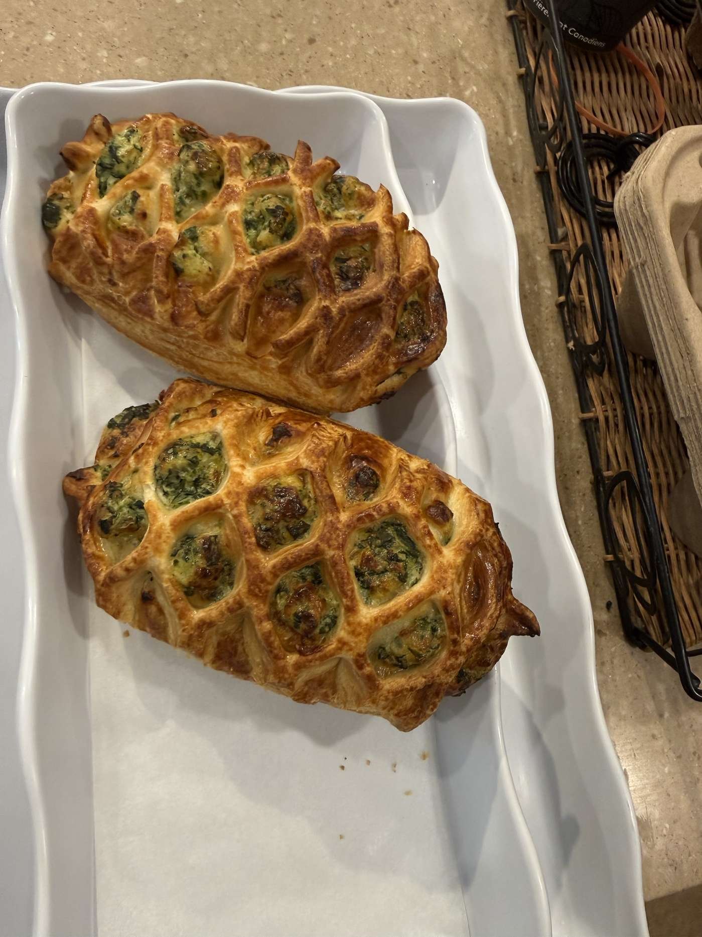 Mini quiches and bite-sized pastries on serving trays