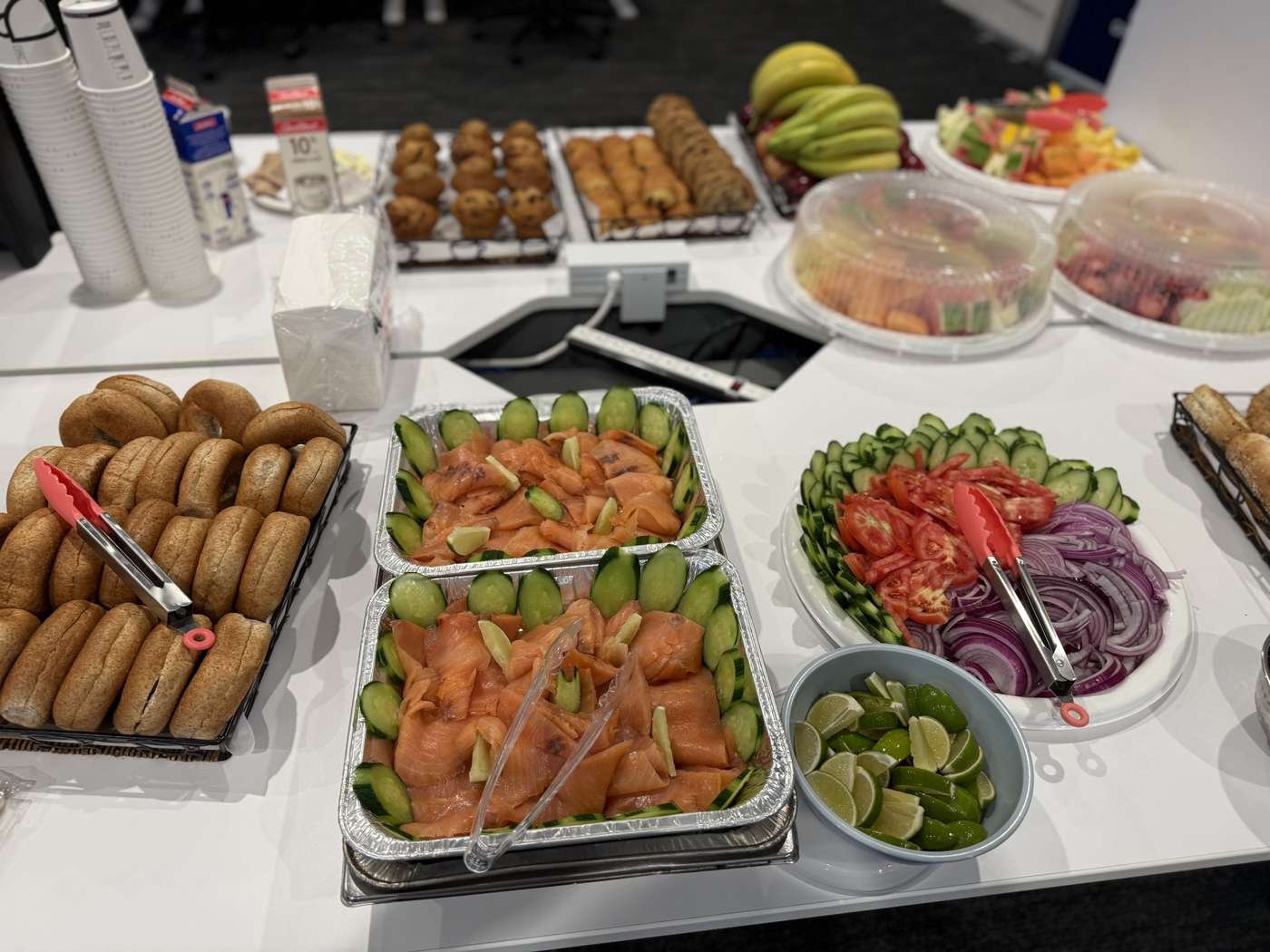 Sandwich and salad platters laid out for a corporate meeting