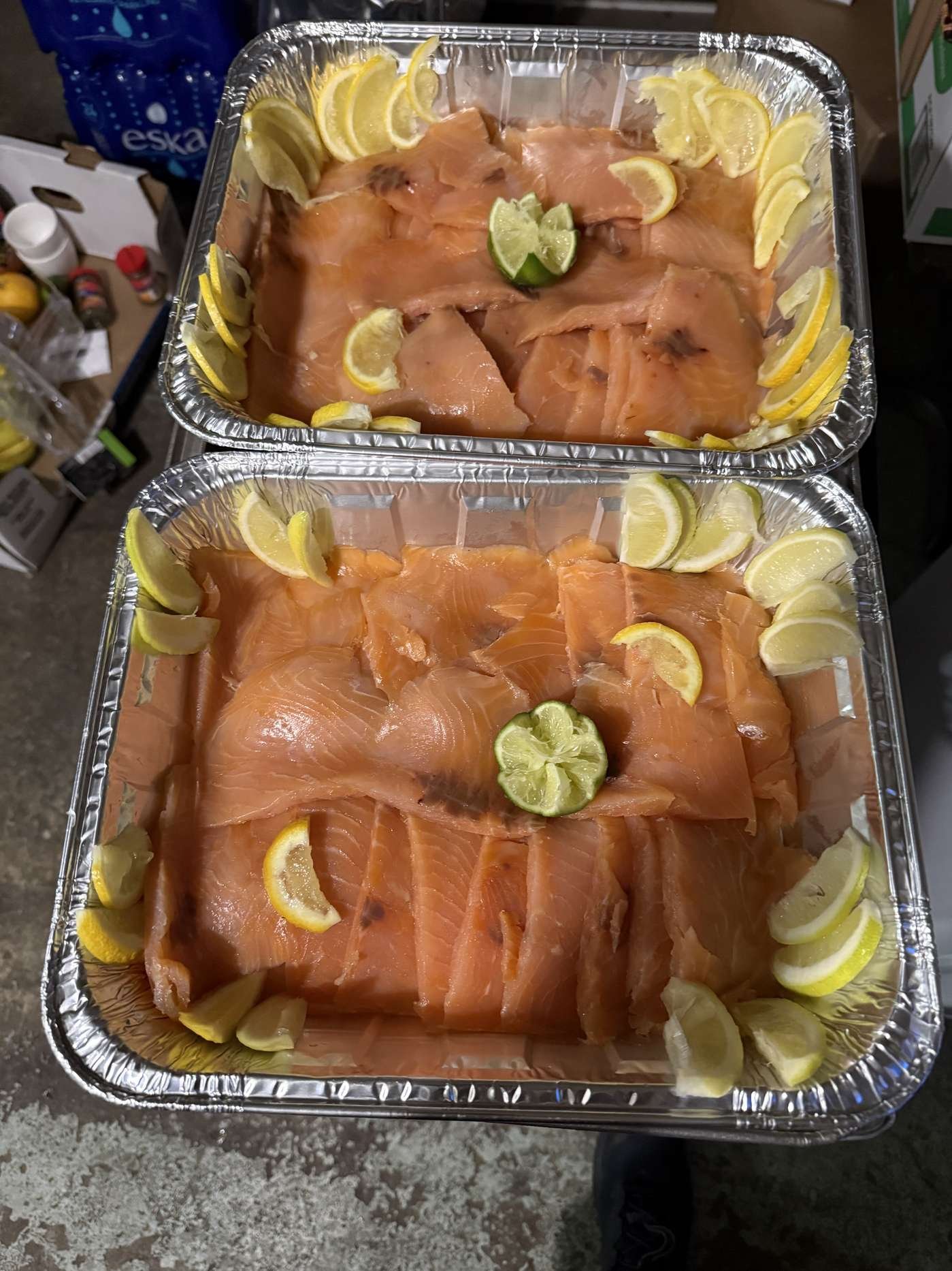 Smoked salmon platter with lemon, capers and cucumber
